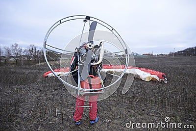 Paramotoring. Paramotorist checking rigging for start to fly Editorial Stock Photo