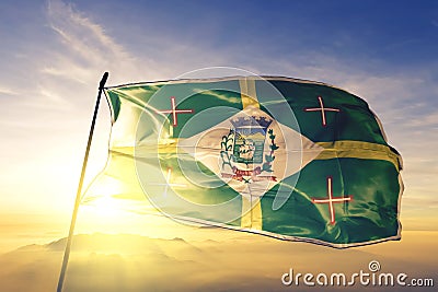 Paranagua of Brazil flag waving on the top sunrise mist fog Stock Photo