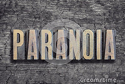 Paranoia word burned wood Stock Photo