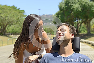 Paraplegic man in wheelchair and girfriend Stock Photo