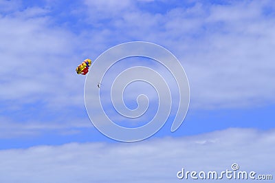 Parasailing above Playa De Las Americas beach Stock Photo