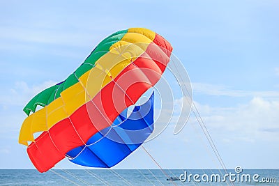 Parasailing, beach umbrella on sky background Stock Photo