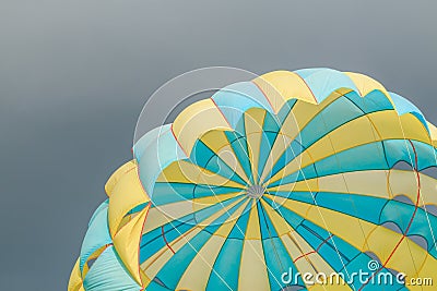 Parasailing, beach umbrella on sky background Stock Photo