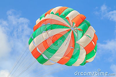 Parasailing, beach umbrella on sky background Stock Photo