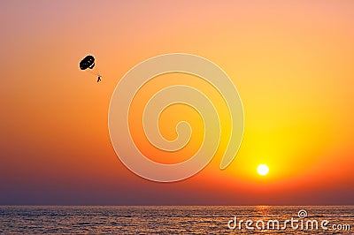 Parasailing during sunset on the sea Stock Photo