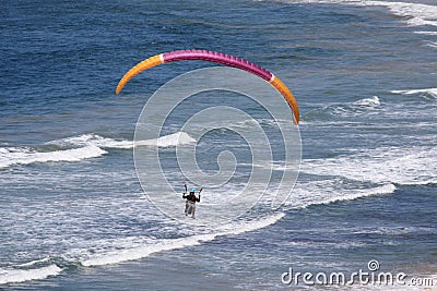 Parashoot flying along the coast Stock Photo