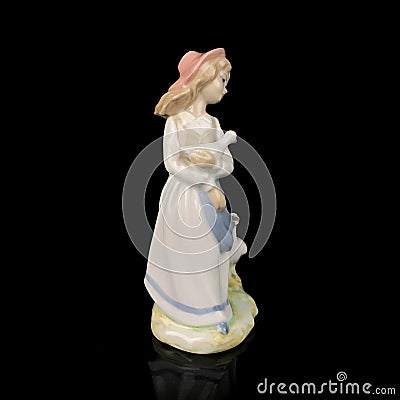 Parcel statuette of a young girl. porcelain antique girl figurine Stock Photo