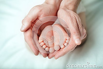 Parental care - sweet baby, foot Stock Photo