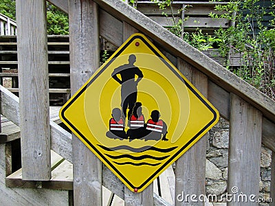 Watch your child by the water sign Stock Photo