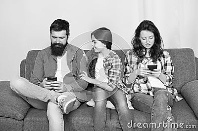 Parenthood failure. Ignored baby. Offended feelings. Stop ignoring kid. Stuck in online. Ignored child. Busy parents Stock Photo