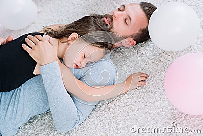 Parenting tired father daughter asleep hug love Stock Photo