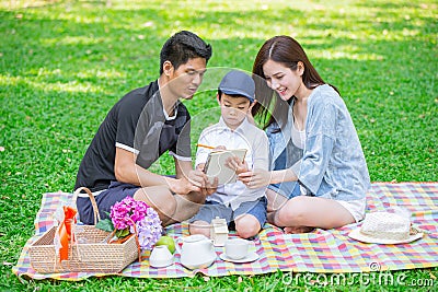 Parents as Teachers concept: Teen family with one kid happy education moment Stock Photo