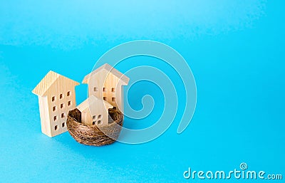 Parents and child in the metaphor of houses. Investing in real estate. Construction, development. Realtor services. Mortgage. Stock Photo