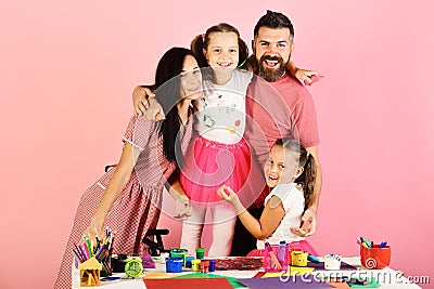 Parents and children hold colorful markers and pose Stock Photo