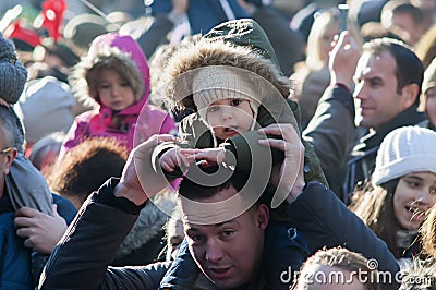 Parents with children on shoulders Editorial Stock Photo