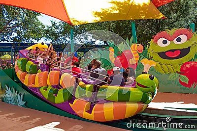Parents and childs having fun at Slimey`s Slider in Sesame Street area at Seaworld in International Drive area 2 Editorial Stock Photo