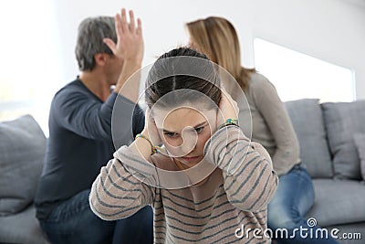 Parents fighting in front of little girl Stock Photo