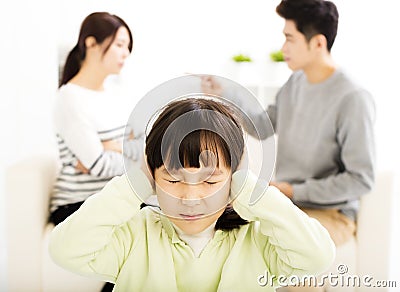 Parents fighting and little girl being upset Stock Photo