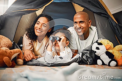 Parents, girl and binoculars in tent, home and smile for games, toys or bonding with love for playing together. Mom, kid Stock Photo