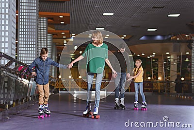 parents and kids skating on roller Stock Photo