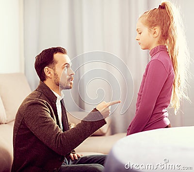 Parents lecturing daughter Stock Photo