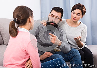 Parents lecturing daughter Stock Photo