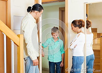 Parents meeting with scold of son Stock Photo
