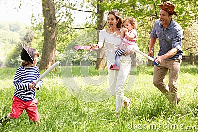 Parents Playing Adventure Game With Children Stock Photo