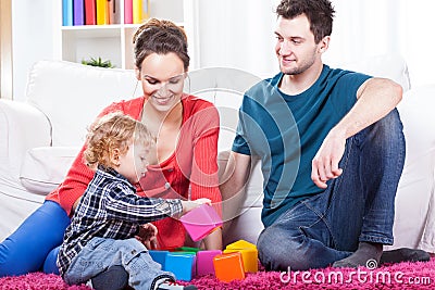 Parents playing with child Stock Photo