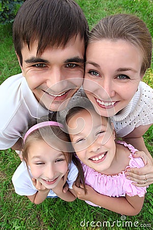 Parents stand having embraced children Stock Photo