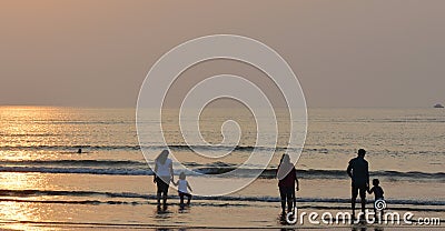 Families at a beach Editorial Stock Photo