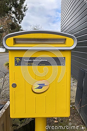 PARIS - APRIL 11, 2021: Yellow postbox of La Poste in Paris, France Editorial Stock Photo