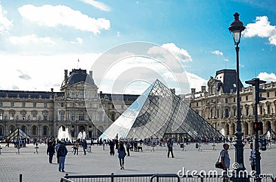 paris, august 2023. the glass pyramid of the louvre and the louvre museum with its visitors and tourists Editorial Stock Photo