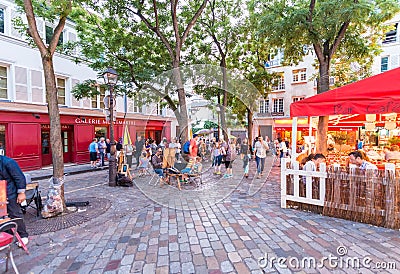 PARIS - CIRCA JUNE, 2014: Tourists in beautiful streets of Montmartre Editorial Stock Photo