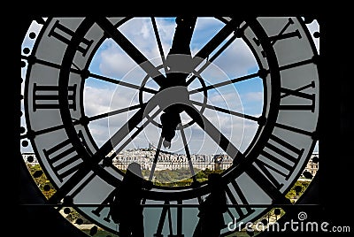 Paris cityscape through the giant glass clock at the Musee d`Orsay Editorial Stock Photo