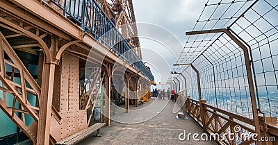 PARIS - DECEMBER 2012: Tourists on the top of Eiffel Tower. The Editorial Stock Photo