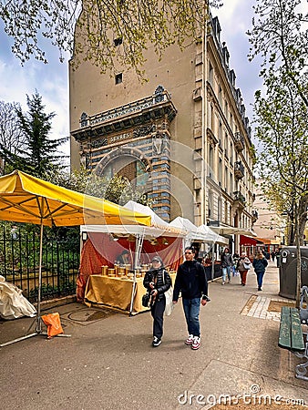 people passing food stalls and market in paris Editorial Stock Photo