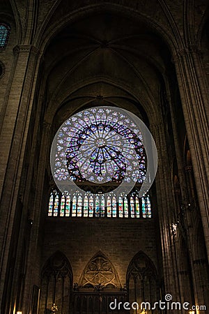 Paris, France - April 1, 2019: Rose stained glass window of Notre Dame Cathedral Editorial Stock Photo