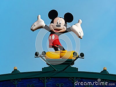 Statue of mickey mouse against light blue sky background at disneyland funfair Editorial Stock Photo