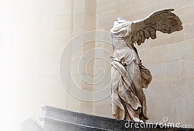 PARIS, FRANCE - April 15, 2015 : Winged Victory of Samothrace, called Nike of Samothrace, marble sculpture in Louvre Museum Editorial Stock Photo