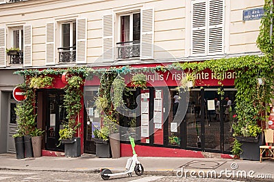 Paris, France. August 2022. Bistrot in Montmartre, one of the most vibrant and popular districts of Paris, the French Editorial Stock Photo