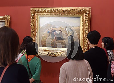 Paris, France - August 29, 2019: Visitors near the Gleaners Des glaneuses1857 by Jean-FranÃ§ois Millet painting in Museum d` Editorial Stock Photo