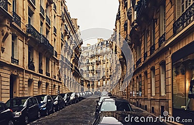 Parisian architecture and historical buildings, restaurants and boutique stores on streets of Paris, France Editorial Stock Photo