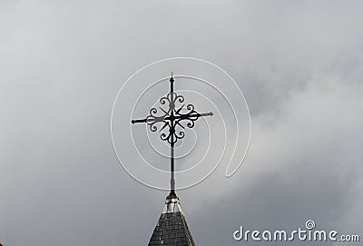 Paris, France, Date 8.13.2018, Time 11 o `clock and 31 minutes,church, Notre-Dame de la Nativite de Bercy forged cross on the roof Editorial Stock Photo