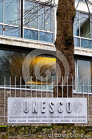Paris, France - DEC 03, 2021: The logo of the UNESCO on fence the United Nations Educational, Scientific and Cultural Organization Editorial Stock Photo