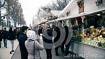 PARIS, FRANCE - DECEMBER, 31, 2016. Crowded Christmas and New Year market. Souvenir, food stalls Editorial Stock Photo