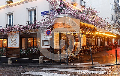 Cafe Le Vrai Paris at rainy morning . It is a traditional French cafe in the Montmartre district, Paris, France Editorial Stock Photo