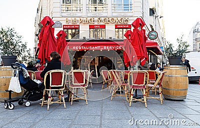 A la place de St. Georges is traditional Parisian restaurant located at St. Georges square in 9th district of Paris. Editorial Stock Photo