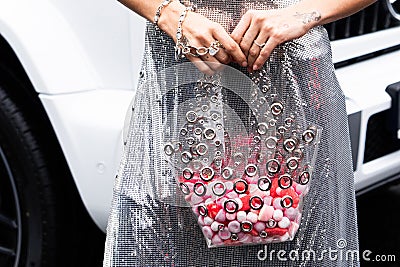 Paris, France - February, 29, 2024: woman wears Rabanne bag, fashion blogger outfit details. Editorial Stock Photo