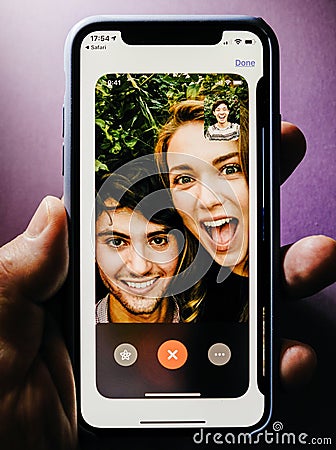 Apple iPhone XS with FaceTime app in App Store Editorial Stock Photo